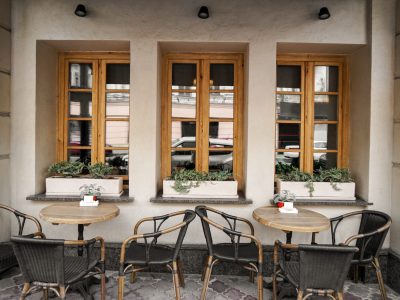 Tables and chairs of city street cafe