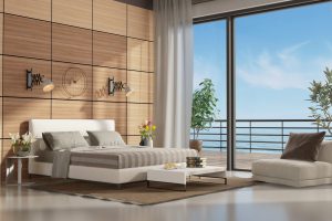 Mastre bedroom with terrace overlooking the sea and double bed against wooden paneling - 3d rendering